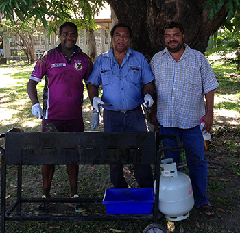 Above (right to left): Jobfind’s Cameron Josiah and Thomas Hudson, and Michael Yam from Kowanyama Aboriginal Shire Council cooking the bbq.